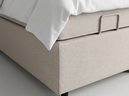 Boxspring Julia met opbergruimte in beige, zijaanzicht met wit beddengoed
